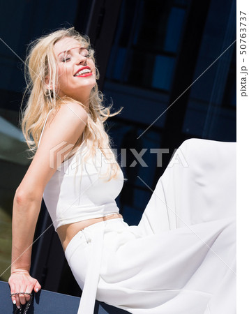 Woman wearing crop top and culottes Woman wearing crop top and culottes 50763737