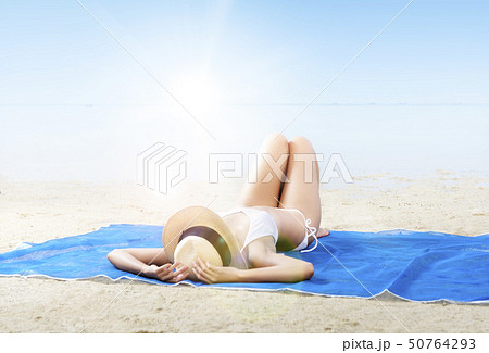 Asian sexy girl in bikini and hat lying Asian sexy girl in bikini and hat lying 50764293