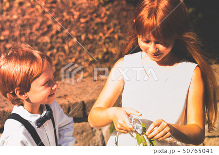 Ring bearer and flower girl at garden wedding Ring bearer and flower girl at garden wedding 50765041