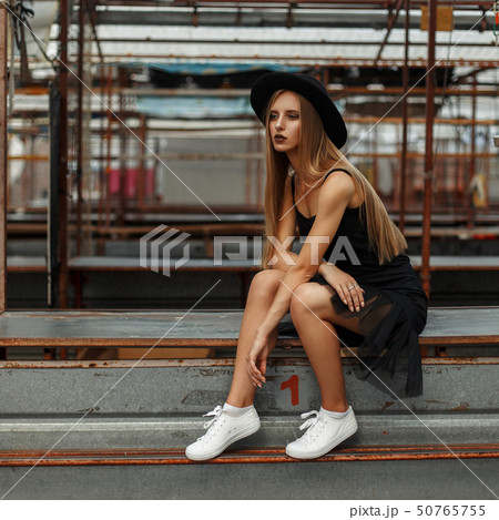 beautiful stylish woman with a fashionable hat beautiful stylish woman with a fashionable hat 50765755