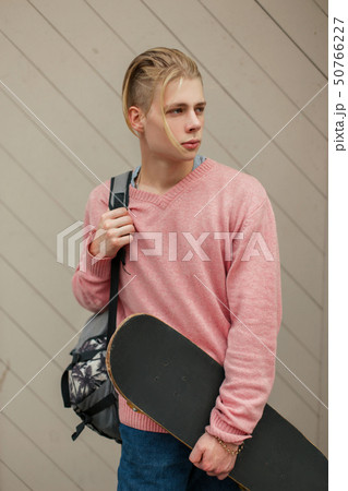Handsome young man with a blonde hairstyle 50766227
