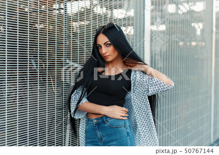 Beautiful young woman with long black hair  50767144