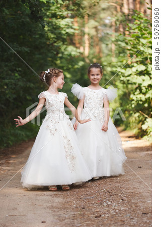 happy beautiful girls with white wedding dresses 50769060