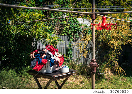 Laundry basket full of cloth 50769639