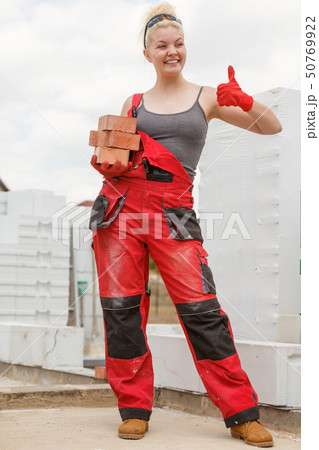 Woman working with bricks Woman working with bricks 50769922