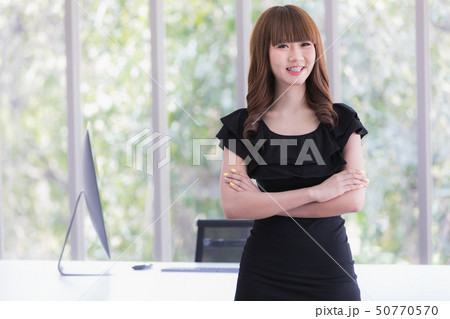 Young lady in black dress Young lady in black dress 50770570