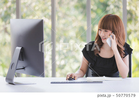 Young lady in black dress 50770579