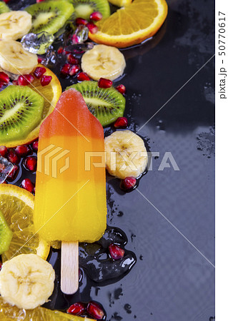 Fruit ice cream on stick with slices fruits  50770617