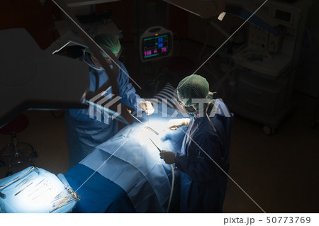 Asian doctor and an assistant in the operating Asian doctor and an assistant in the operating 50773769