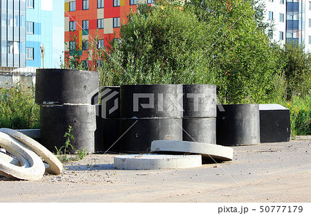 Concrete cylindrical rings for creating storm drains are located near the site where the expansion 50777179
