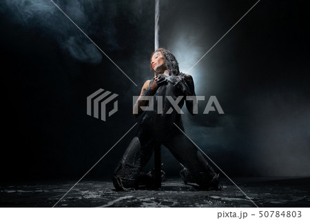 Young sexy dirty woman dancing striptease with pylon 50784803