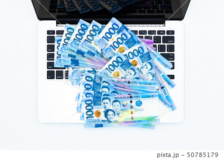 Philippine peso bill with laptop computer. 50785179