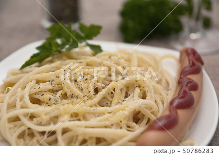 Serving of spaghetti with sausage. Serving of spaghetti with sausage. 50786283