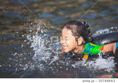 Cute asian child girls playing water Cute asian child girls playing water 50788663