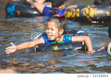 Cute asian child girls playing water Cute asian child girls playing water 50788664