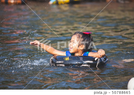 Cute asian child girls playing water Cute asian child girls playing water 50788665
