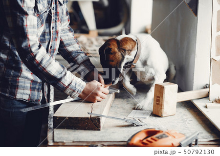 The carpenter works with a tree 50792130