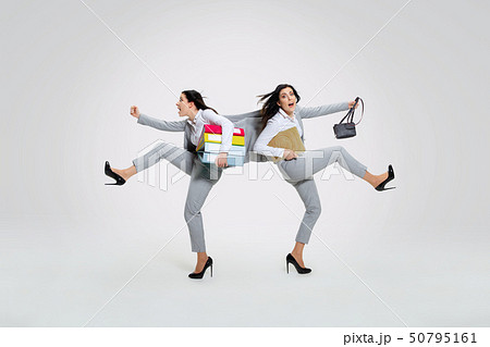 Young woman torning between cases 50795161