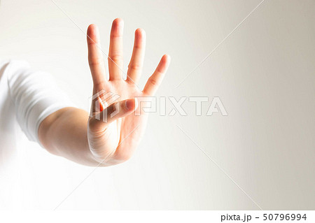 A hand showing number four on white background. A hand showing number four on white background. 50796994