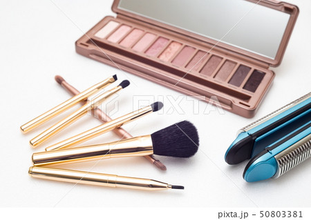 Various makeup products and hairdressing tools on 50803381