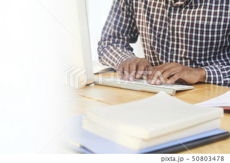 Man working or studying on computer 50803478