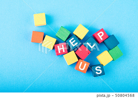 colorful wooden cube with HELP US word 50804568