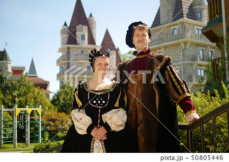couple, duke and duchess against the backdrop of the castle in a beautiful park couple, duke and duchess against the backdrop of the castle in a beautiful park 50805446