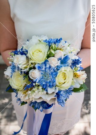 beautiful modern wedding bouquet on white table 50805625