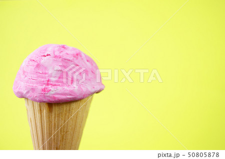 Strawberry ice-cream scoop in waffle cone  50805878