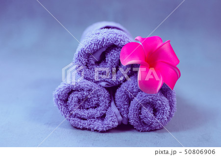 Spa setting towels with plumeria flower 50806906