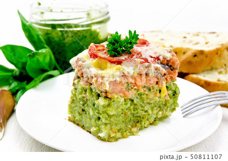 Casserole of salmon and rice on light board 50811107