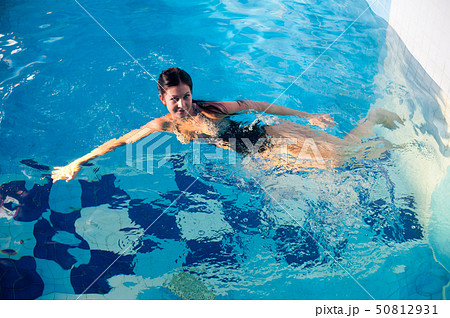 Attractive girl in swimming pool Attractive girl in swimming pool 50812931