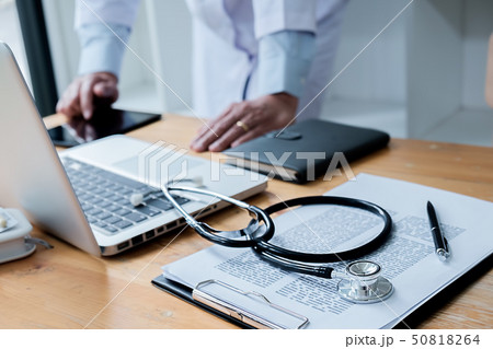 Patient listening intently to a male doctor Patient listening intently to a male doctor 50818264