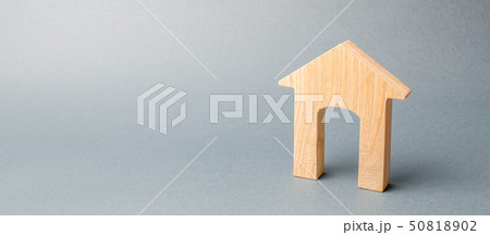 Miniature wooden house on a gray background. 50818902