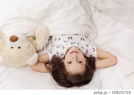 cute little child girl wakes up from sleep cute little child girl wakes up from sleep 50820739