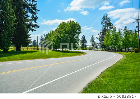 Turn of asphalt road in rural area of Fraser Valley in British Columbia. Turn of asphalt road in rural area of Fraser Valley in British Columbia. 50823817