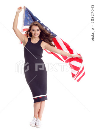 Happy young woman holding USA flag. Image isolated Happy young woman holding USA flag. Image isolated 50827045