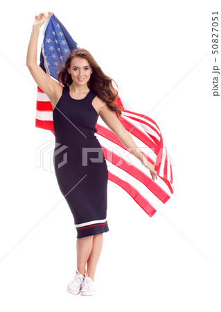 Happy young woman holding USA flag. Image isolated 50827051