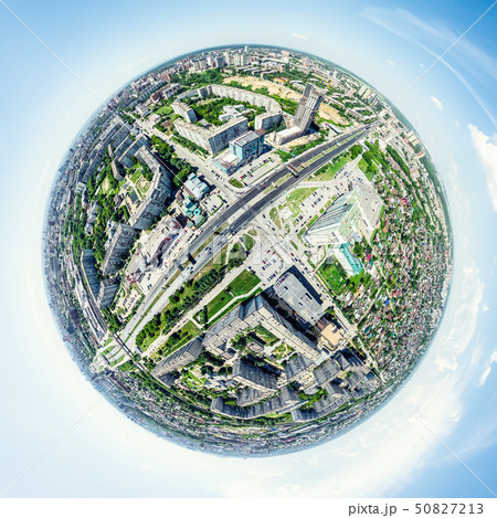 Aerial city view with crossroads and roads, houses, buildings, parks and parking lots. Sunny summer Aerial city view with crossroads and roads, houses, buildings, parks and parking lots. Sunny summer 50827213