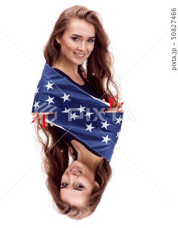 Happy young girl holding USA flag isolated on white background Happy young girl holding USA flag isolated on white background 50827466