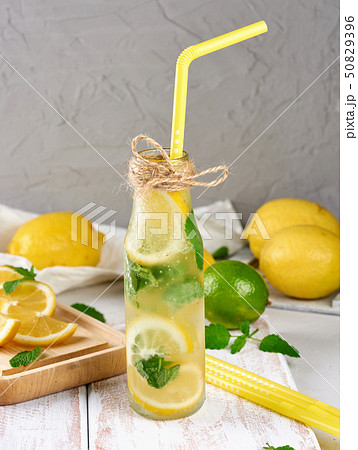 cold drink with lemons, mint leaves, lime in a 50829396