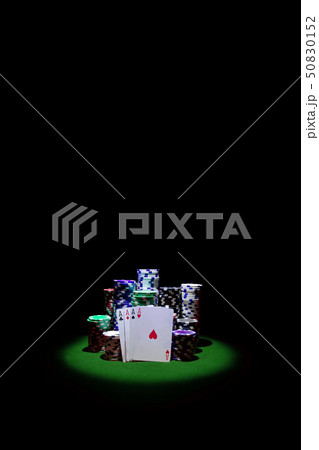 Four Aces with chip stack on green Table VERTICAL Four Aces with chip stack on green Table VERTICAL 50830152