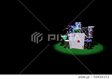 Four Aces with chip stack on green Table Four Aces with chip stack on green Table 50830153