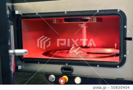Object printed from metal powder on metal 3d printer, working chamber. Object printed from metal powder on metal 3d printer, working chamber. 50830404