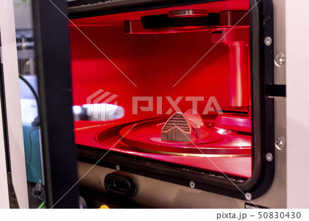 Object printed from metal powder on metal 3d printer, working chamber. Object printed from metal powder on metal 3d printer, working chamber. 50830430