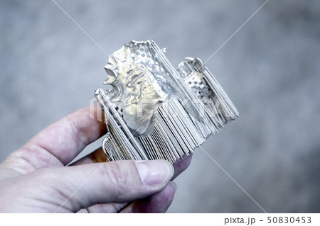 Man is holding object printed on metal 3d printer. Man is holding object printed on metal 3d printer. 50830453