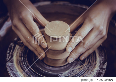 Creating ceramic products of white clay close-up. 50830469