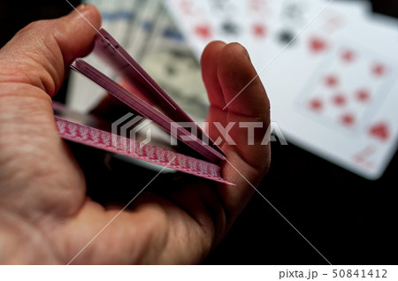 Playing Cards in Male Player Hands. Playing Cards in Male Player Hands. 50841412