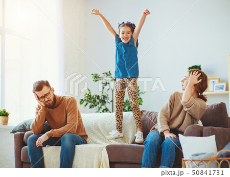 naughty, mischievous, child girl jumping, laughing naughty, mischievous, child girl jumping, laughing 50841731