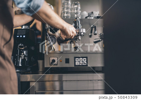 Selective focus of the espresso machine with filter holder in it Selective focus of the espresso machine with filter holder in it 50843309